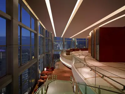 a large building with a view of a city from a building at Grand Hyatt Kuala Lumpur in Kuala Lumpur