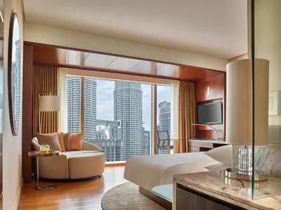 a hotel room with a bed and a large window at Grand Hyatt Kuala Lumpur in Kuala Lumpur