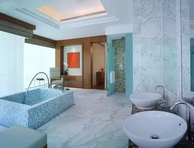 a bathroom with two sinks and a bath tub at Grand Hyatt Kuala Lumpur in Kuala Lumpur