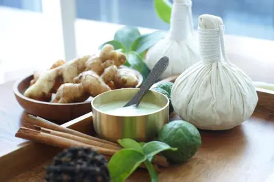 a table with a bowl of food and a bowl of garlic at Grand Hyatt Kuala Lumpur in Kuala Lumpur