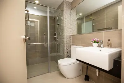 a bathroom with a toilet and a sink and a shower at Velocity KL By PSM Luxury Suites in Kuala Lumpur
