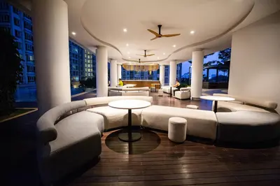 a large living room with a couch and tables at Velocity KL By PSM Luxury Suites in Kuala Lumpur