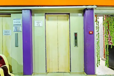 a group of doors on the side of a building at Hotel O Elwarda Klcity in Kuala Lumpur
