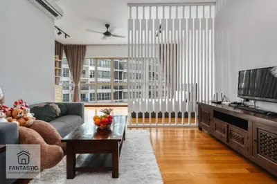 a living room with a couch and a tv at Regalia Residence by FANTASTIC in Kuala Lumpur