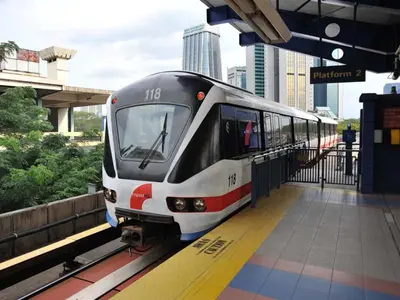 a train is stopped at a train station at AnCasa Hotel Kuala Lumpur, Chinatown in Kuala Lumpur