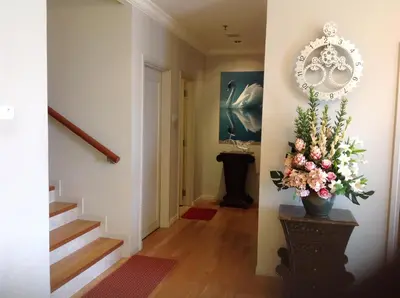 a hallway with a vase of flowers on a table at Times Service Suites @ Times Square in Kuala Lumpur