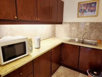 a kitchen with a microwave and a sink at Times Service Suites @ Times Square in Kuala Lumpur