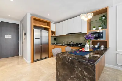 a kitchen with a large island in the middle at Anggun Residences Serviced Suites in Kuala Lumpur