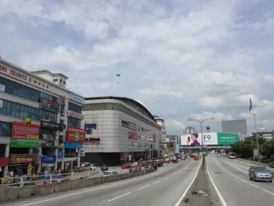 a busy city street with cars on the road at Safari Hotel in Kuala Lumpur