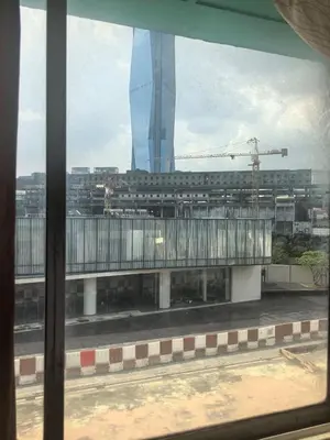 a view out of a window of a building at Sha La La Hostel in Kuala Lumpur