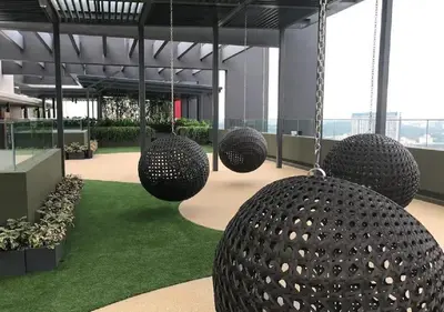 a building with several large spheres hanging from the ceiling at Velocity Residence in Kuala Lumpur