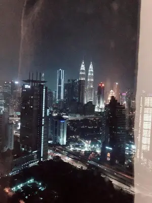 a view of a city at night with at Expressionz Suites near KLCC, IJN by Wodages in Kuala Lumpur