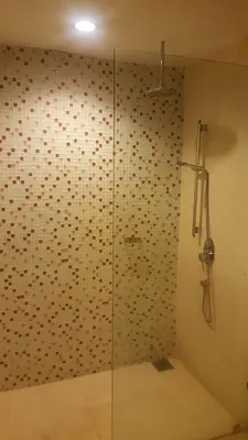 a shower with a glass door in a bathroom at Regalia Upper View Hotel in Kuala Lumpur