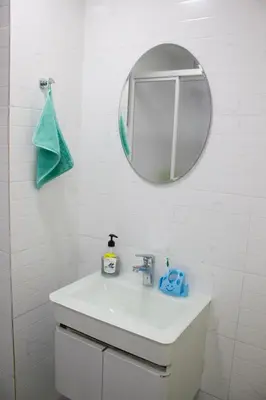 a white bathroom with a sink and a mirror at The FORUM condominium, Jalan Inai, Off Jalan Tun Razak in Kuala Lumpur