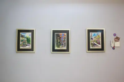a group of four framed pictures on a wall at The FORUM condominium, Jalan Inai, Off Jalan Tun Razak in Kuala Lumpur