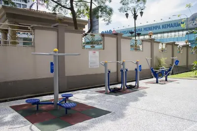a row of playground equipment in front of a building at The FORUM condominium, Jalan Inai, Off Jalan Tun Razak in Kuala Lumpur