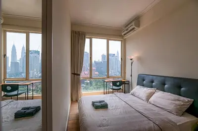 a bedroom with a bed and a large window at Rex Ollie @ 231 TR Suite in Kuala Lumpur