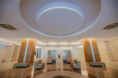 a waiting room with chairs and a large ceiling at Rex Ollie @ 231 TR Suite in Kuala Lumpur