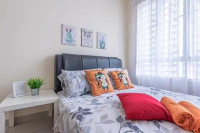 a bed with a black headboard and pillows in a bedroom at PV21 Setapak, Share House Room Only in Kuala Lumpur
