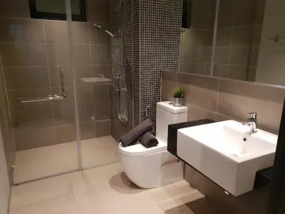 a bathroom with a toilet and a sink and a shower at Sunway Velocity V Residence Suites in Kuala Lumpur