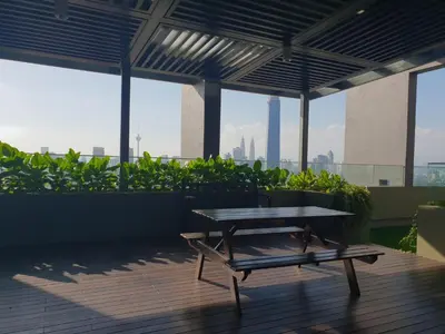 a picnic table on the roof of a building at Sunway Velocity V Residence Suites in Kuala Lumpur