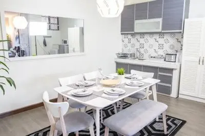 a white dining room table and chairs in a kitchen at Omar's Place 1 in Kuala Lumpur