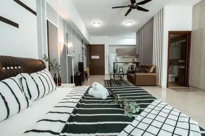 a large living room with a couch and a living room at Regalia Residence The Sky Pool Suite in Kuala Lumpur