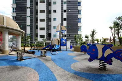 an empty playground in front of a building at Zeta Desky in Kuala Lumpur