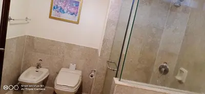 a bathroom with a shower and a toilet at KL Times Square Apartment in Kuala Lumpur