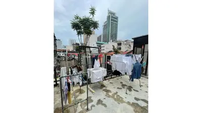 a balcony with clothes drying on a clothes line at Mingle Highstreet - CoWorking Hub in Kuala Lumpur