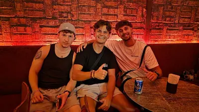 three men sitting at a table in a bar at Mingle Highstreet - CoWorking Hub in Kuala Lumpur