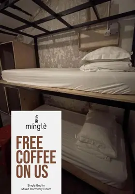a free coffee on us sign next to a bunk bed at Mingle Highstreet - CoWorking Hub in Kuala Lumpur