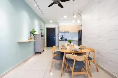 a kitchen and dining room with a wooden table and chairs at 3 Rooms Elegant Minimalist Design Setapak 15min KLCC in Kuala Lumpur