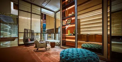a lobby with two chairs and a couch in a building at EQ Kuala Lumpur in Kuala Lumpur