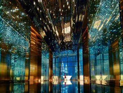 a room with a large window and a chandelier at EQ Kuala Lumpur in Kuala Lumpur