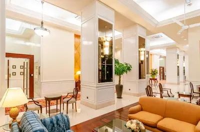 a living room with a couch and a table at Wedgewood Residences in Kuala Lumpur