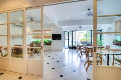 a dining room with a table and chairs at Wedgewood Residences in Kuala Lumpur