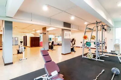 a gym with treadmills and exercise equipment in a building at Wedgewood Residences in Kuala Lumpur