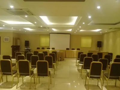 a room with rows of chairs and a whiteboard at Hotel Valenza in Kuala Lumpur