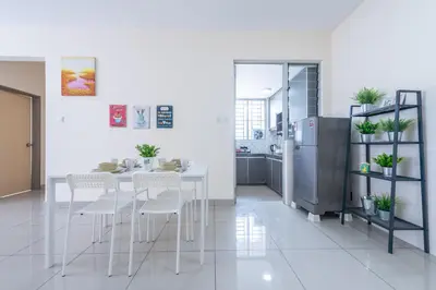 a kitchen with a table and chairs and a refrigerator at PV21 Setapak, Wangsamaju, Melawati, 15min to KLCC B36a in Kuala Lumpur