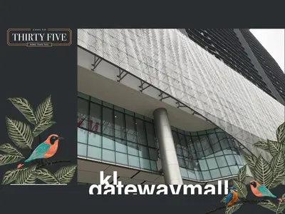 a building with a bird on the side of it at KL Gateway Premium Residence - Easy LRT Access in Kuala Lumpur