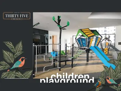 a children playground with a slide in a room at KL Gateway Premium Residence - Easy LRT Access in Kuala Lumpur