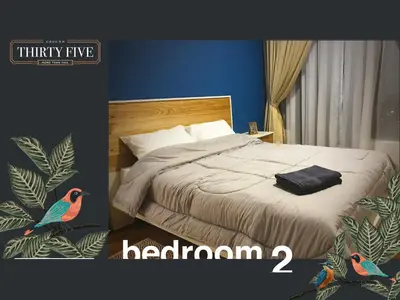 a bedroom with a bed with a bird on it at KL Gateway Premium Residence - Easy LRT Access in Kuala Lumpur