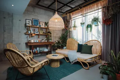 a living room with wicker chairs and a couch at KLoe Hotel in Kuala Lumpur