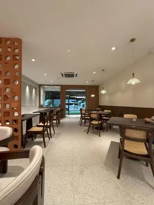 a dining room with tables and chairs and a dining area at D'Garden Hotel Kuala Lumpur in Kuala Lumpur