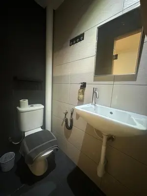 a bathroom with a sink and a toilet at D'Garden Hotel Kuala Lumpur in Kuala Lumpur