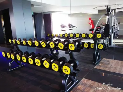 a row of rows of dumbbells in a gym at Dorsett Residences Sri Hartamas KL in Kuala Lumpur