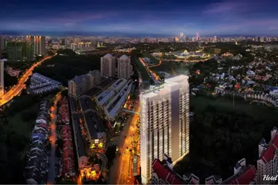 a city skyline with a tall building at night at Dorsett Residences Sri Hartamas KL in Kuala Lumpur