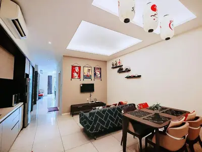 a living room with a couch and a table at Dorsett Residences Sri Hartamas KL in Kuala Lumpur