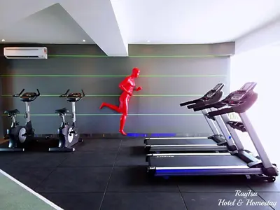 a person jumping off a treadmill in a gym at Dorsett Residences Sri Hartamas in Kuala Lumpur